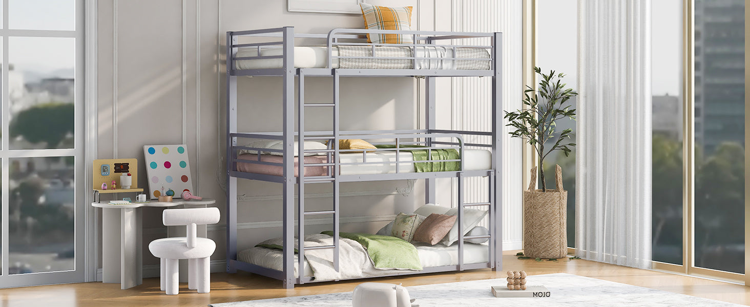 Gray metal triple bunk bed with white bedding and green accents