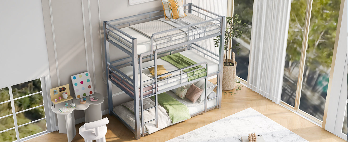 Silver metal triple bunk bed with white mattresses and greenyellow bedding