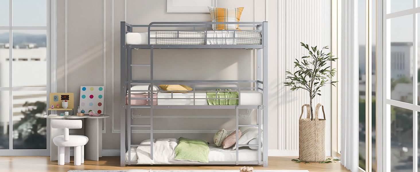 Silver metal triple bunk bed with white and grey bedding