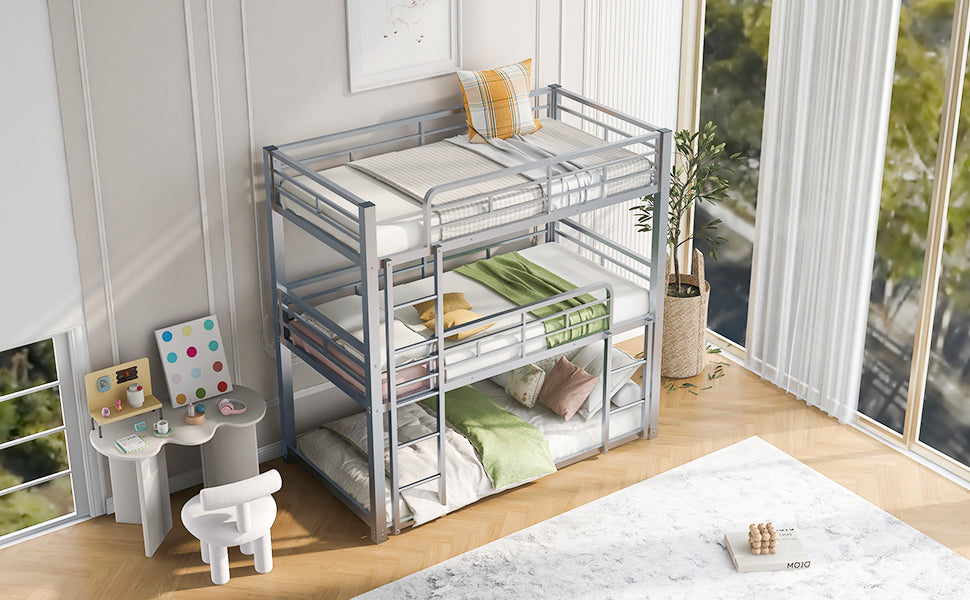 Silver metal triple bunk bed with mattresses and bedding