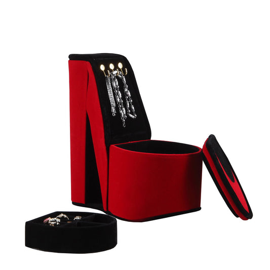 Red velvet jewelry organizer with silver bracelets and rings