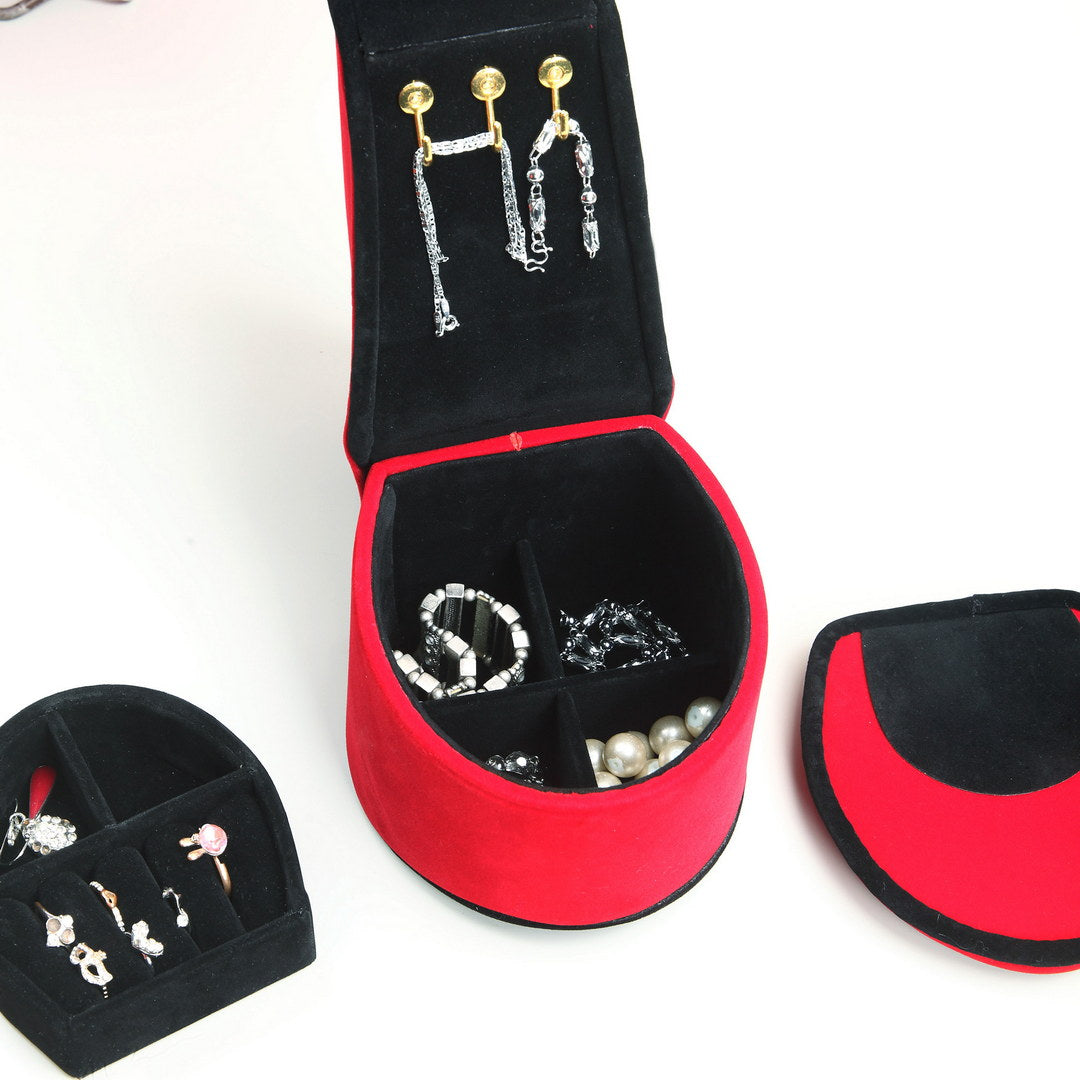 Red velvet jewelry box with hanging earrings and bracelets