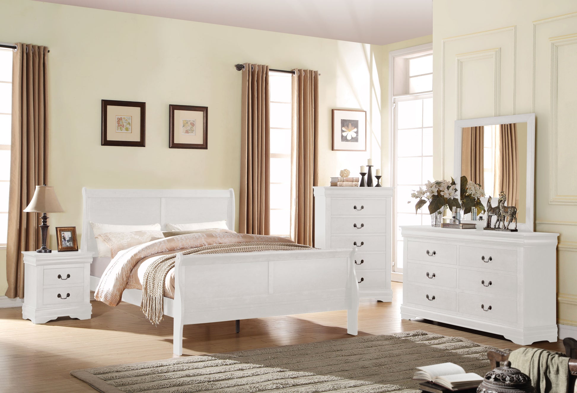 White sleigh bed with ornate detailing and plush bedding