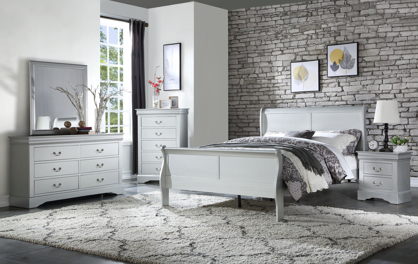 Elegant grey sleigh bed with patterned bedding and throws