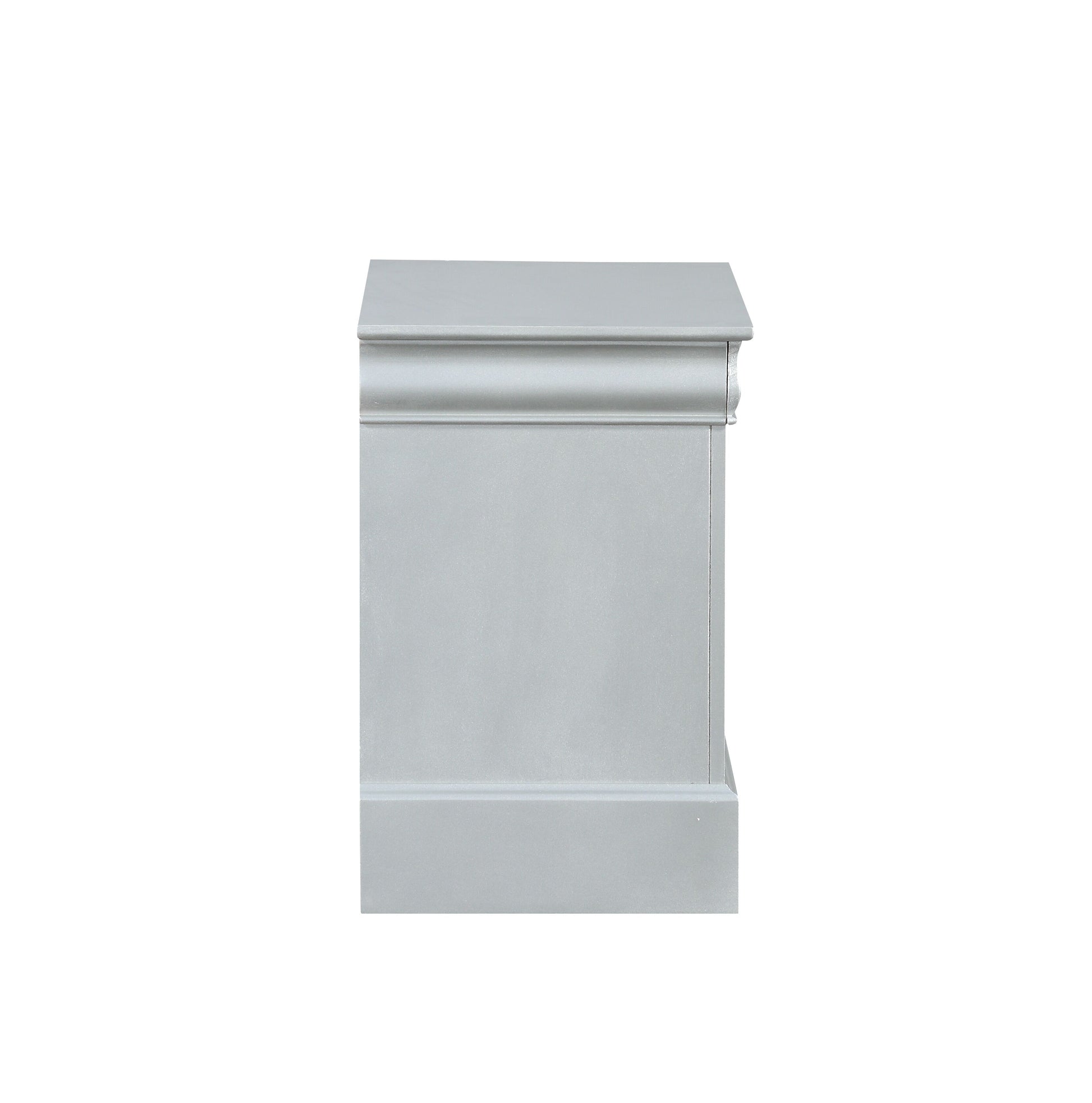 Side view of a light grey painted wooden fireplace surround with ornate molding