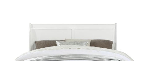 White wooden headboard with upholstered pillows