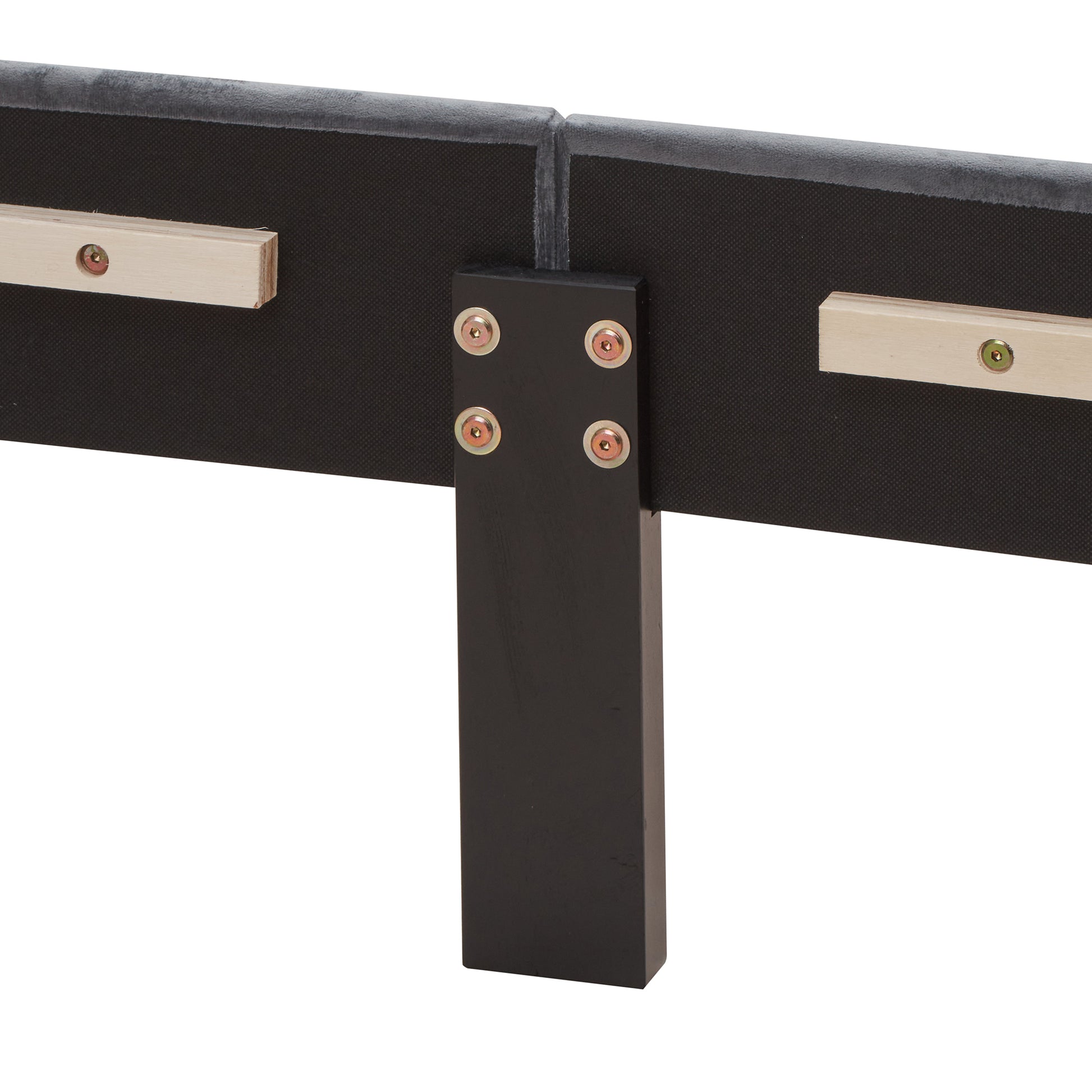 Closeup of upholstered headboard support bracket with visible screws