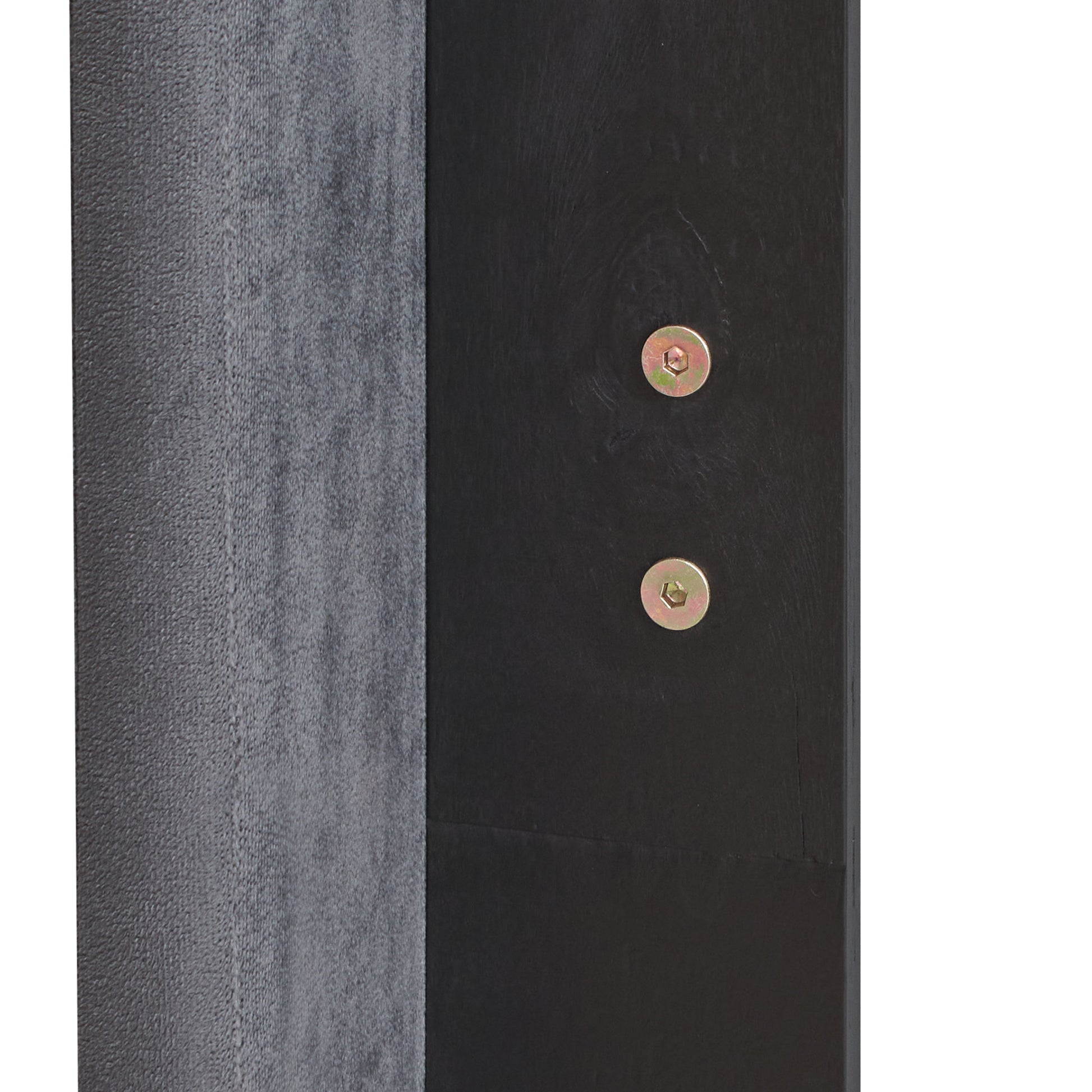 Closeup of textured gray fabric next to a dark wood panel with two silver hex screws