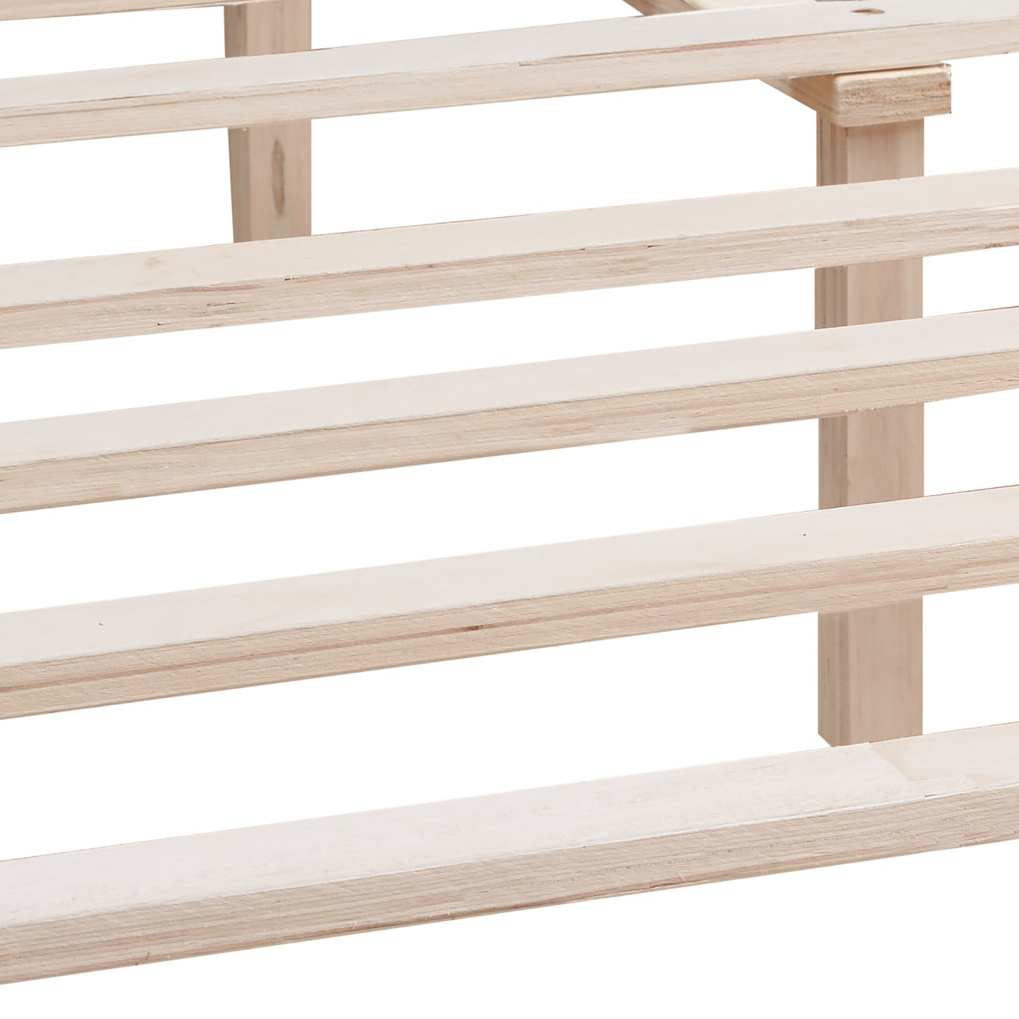 Closeup of light wood bed frame slats and supports