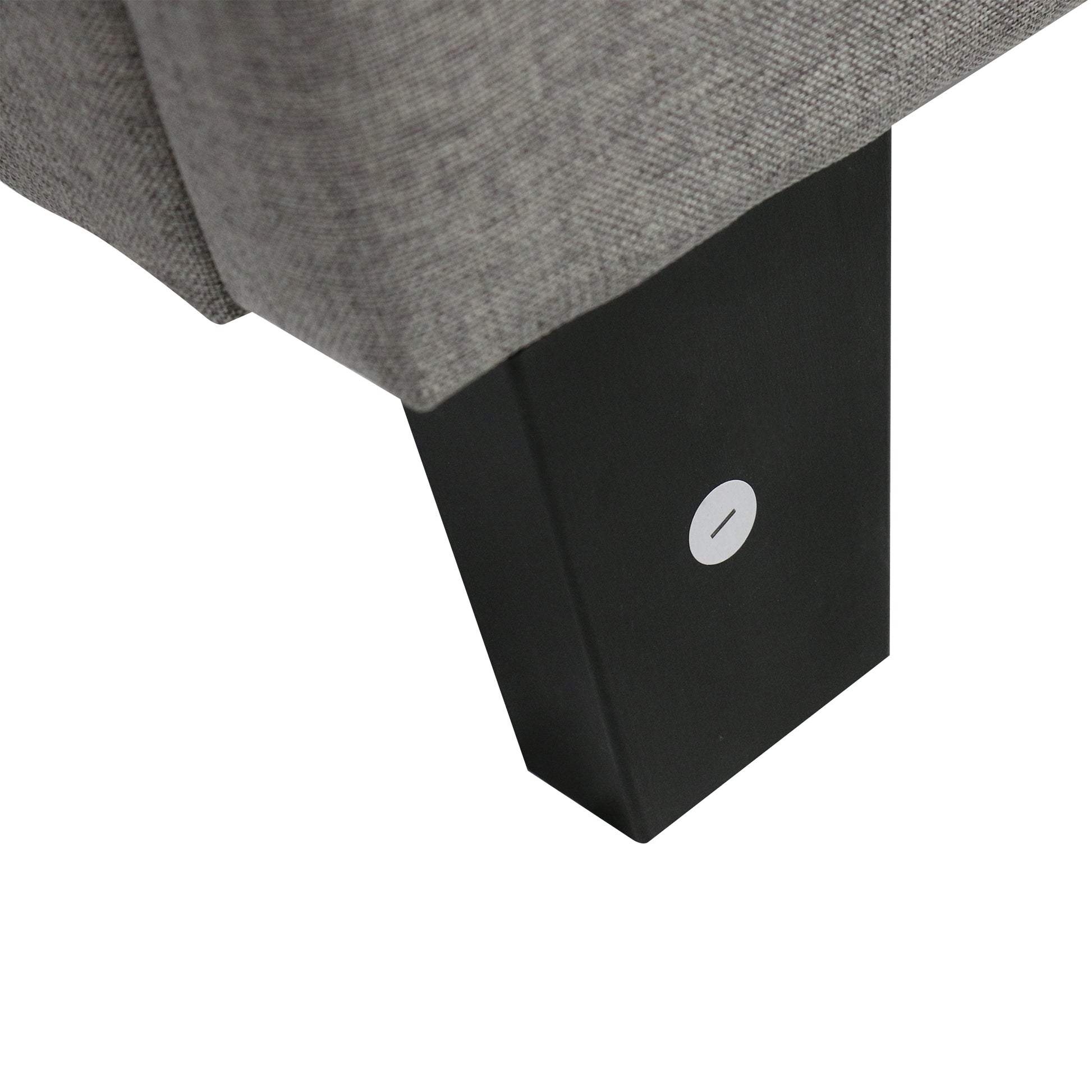 Closeup of gray textured fabric on a modern sofa leg
