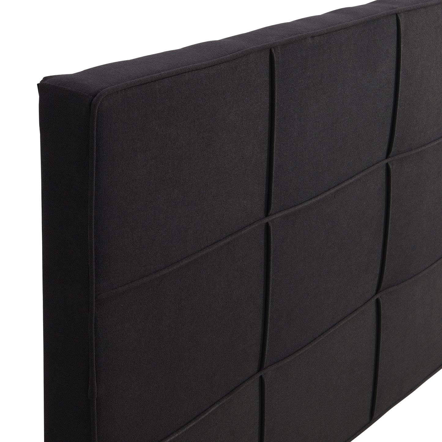Black upholstered headboard with grid stitching