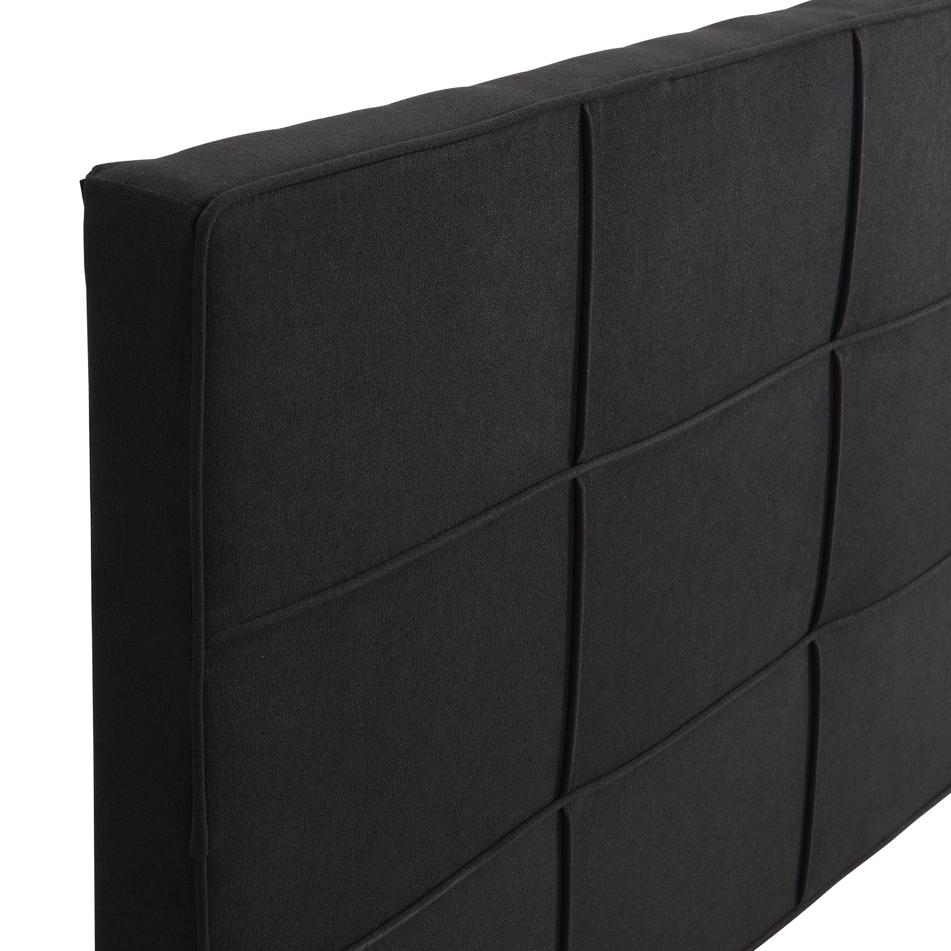Black upholstered headboard with grid stitching