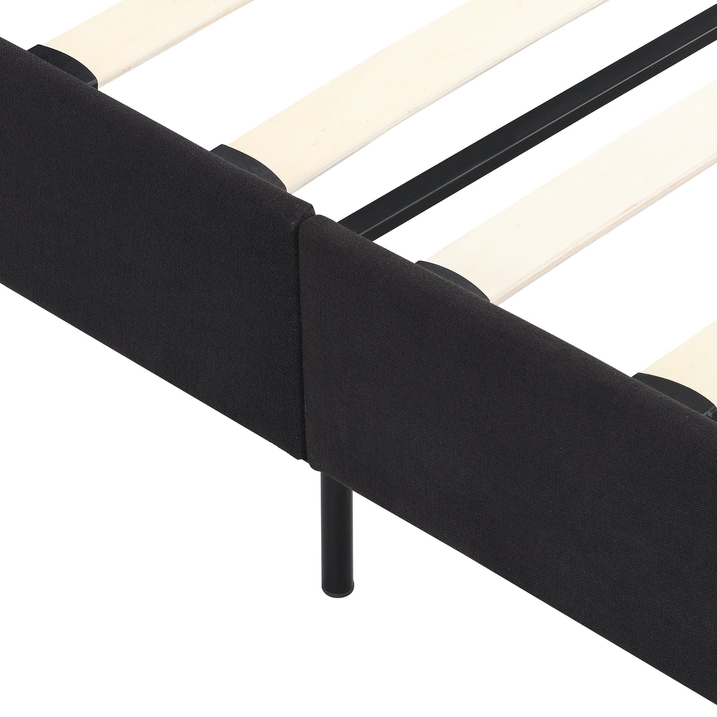 Closeup of a black upholstered bed frame edge with wooden slats and black metal legs