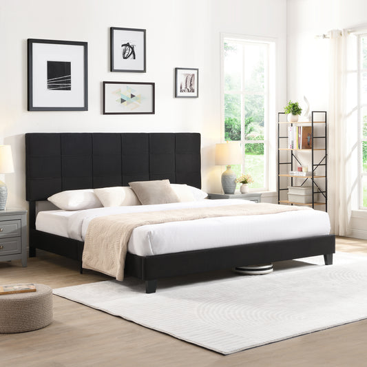 Black upholstered platform bed with a tufted headboard