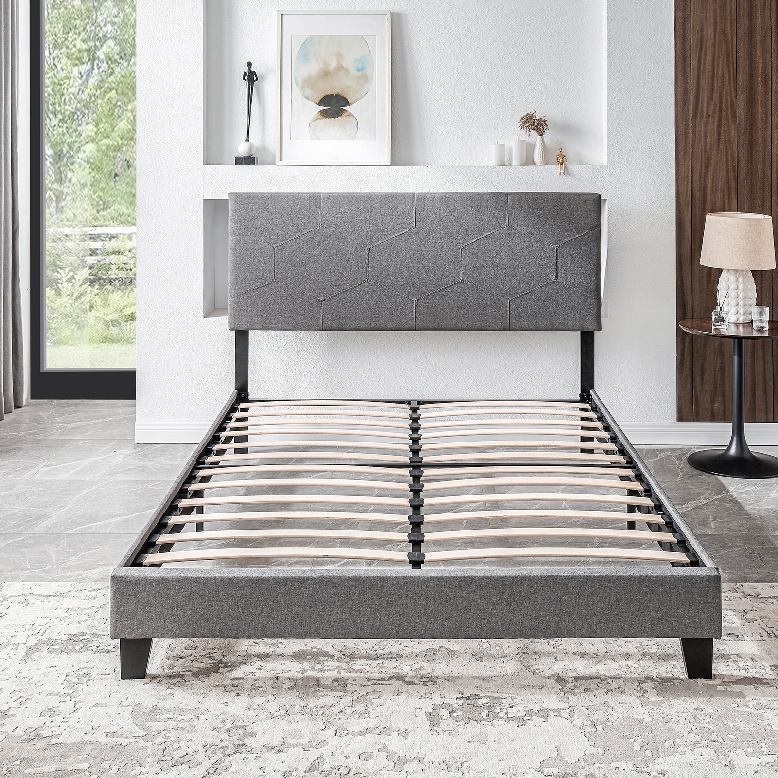 Grey upholstered bed frame with hexagonal pattern headboard and wooden slats queen size