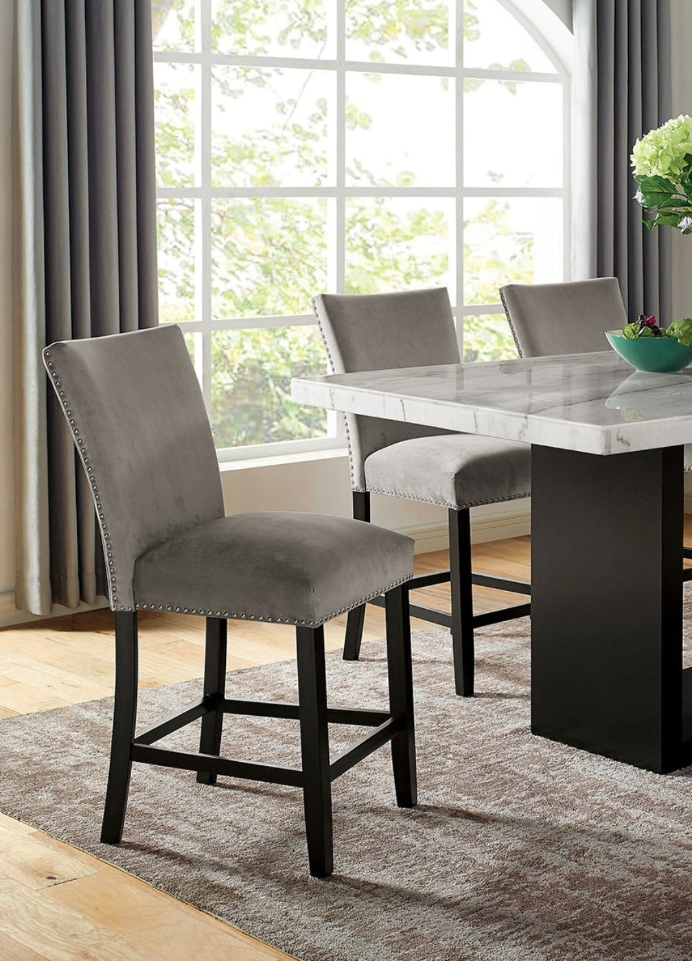 Gray velvet counter stool with silver nailhead trim and dark wood legs