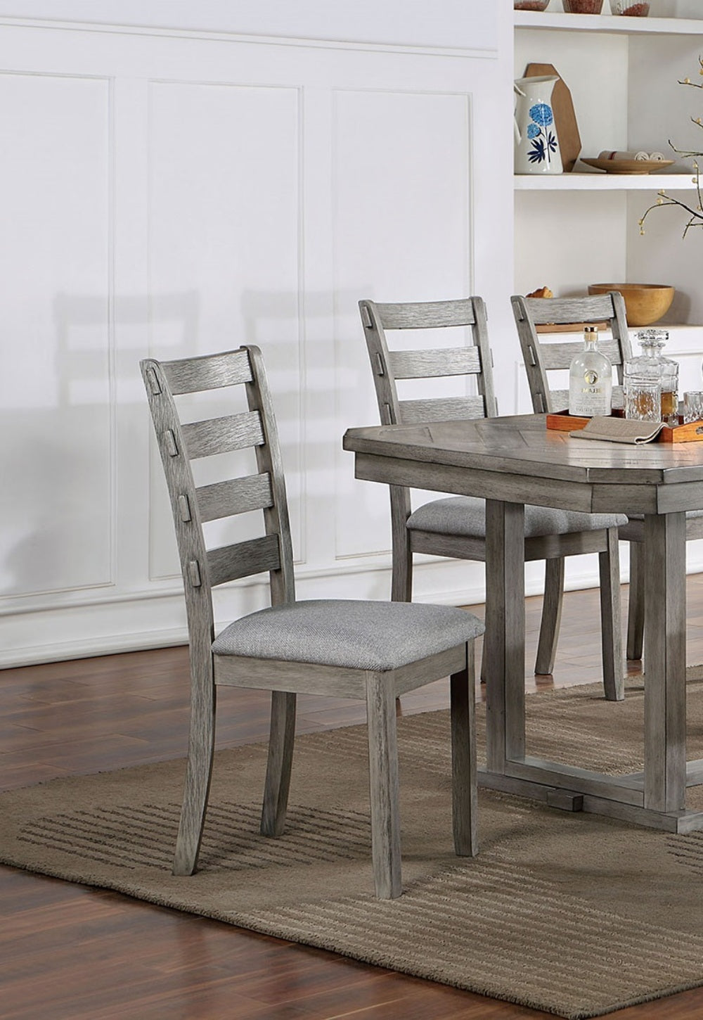 Grey wood dining chairs with upholstered seats
