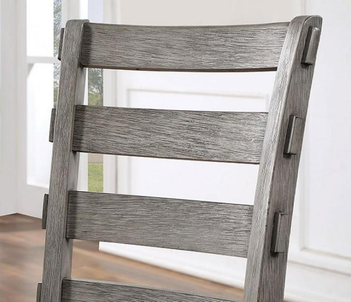 Rustic grey wood dining chair with slatted backrest and metal accents