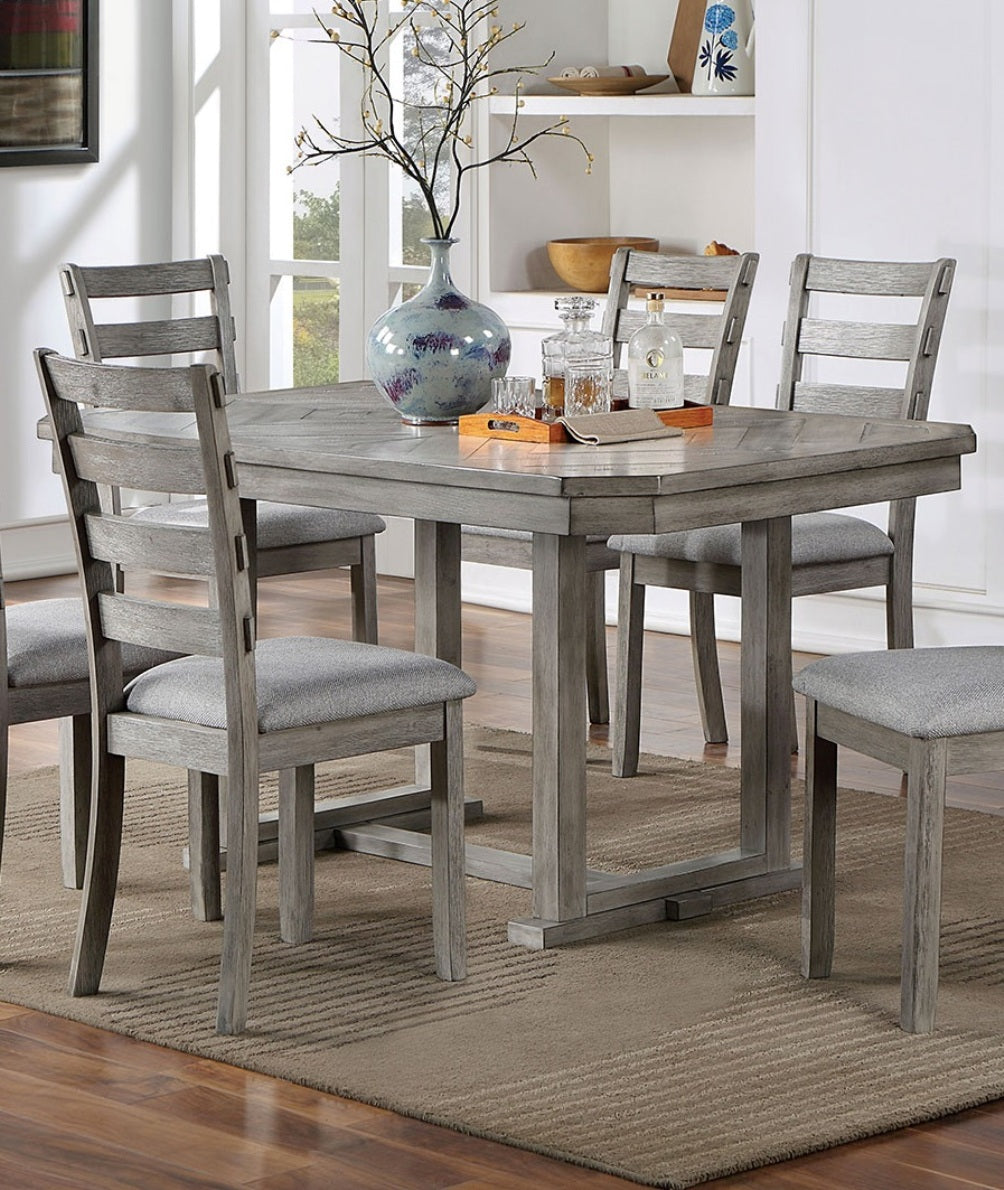 Gray wood dining table with six upholstered chairs
