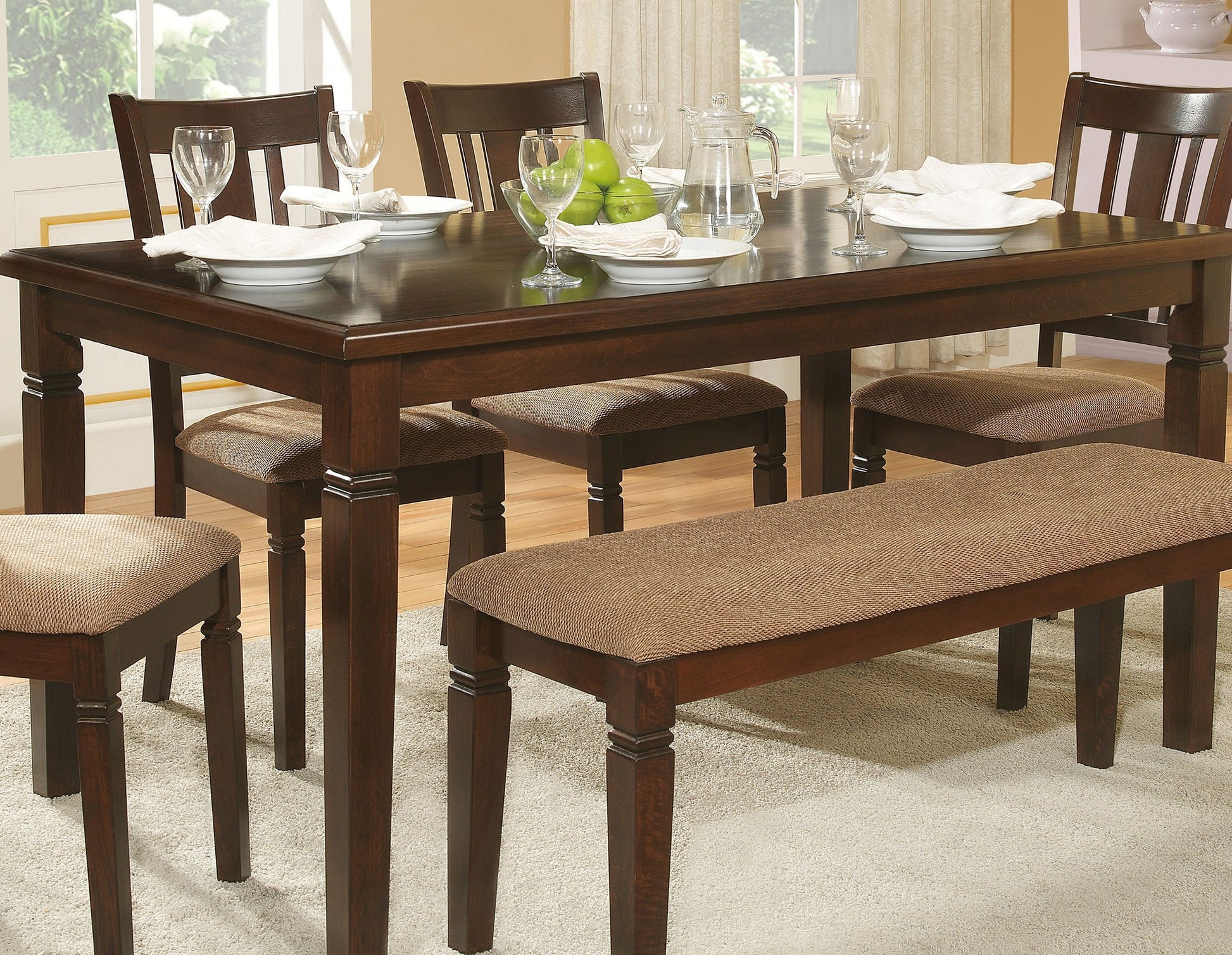 Dark wood dining table with upholstered bench and chairs