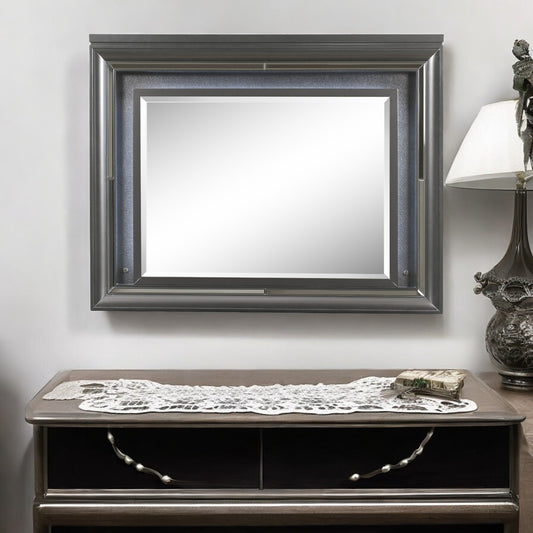 Ornate silver framed wall mirror
