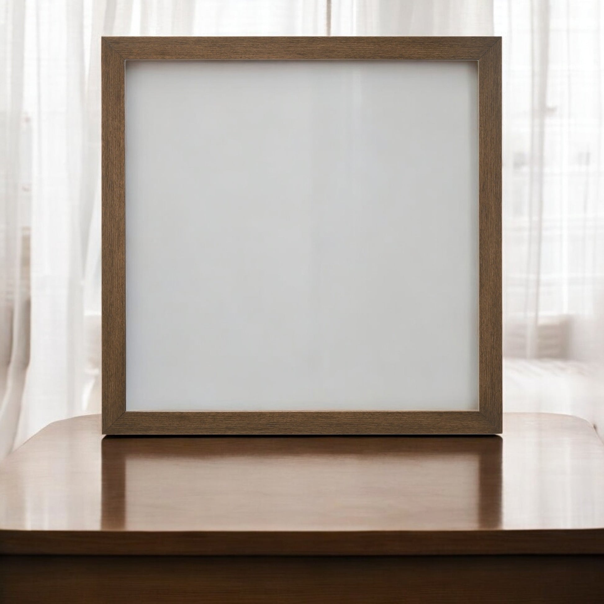 Wooden square picture frame on polished wood surface