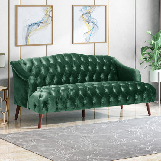 Deep green velvet tufted sofa with rolled arms and wooden legs a luxurious seating option
