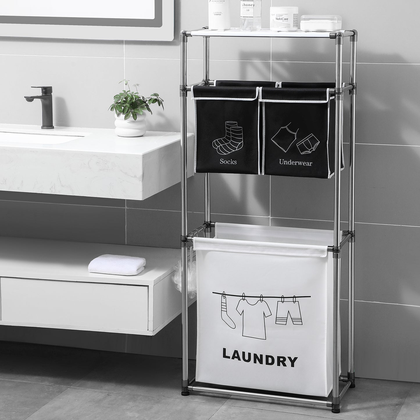 Sleek silver metal laundry hamper with three compartments for organizing clothes
