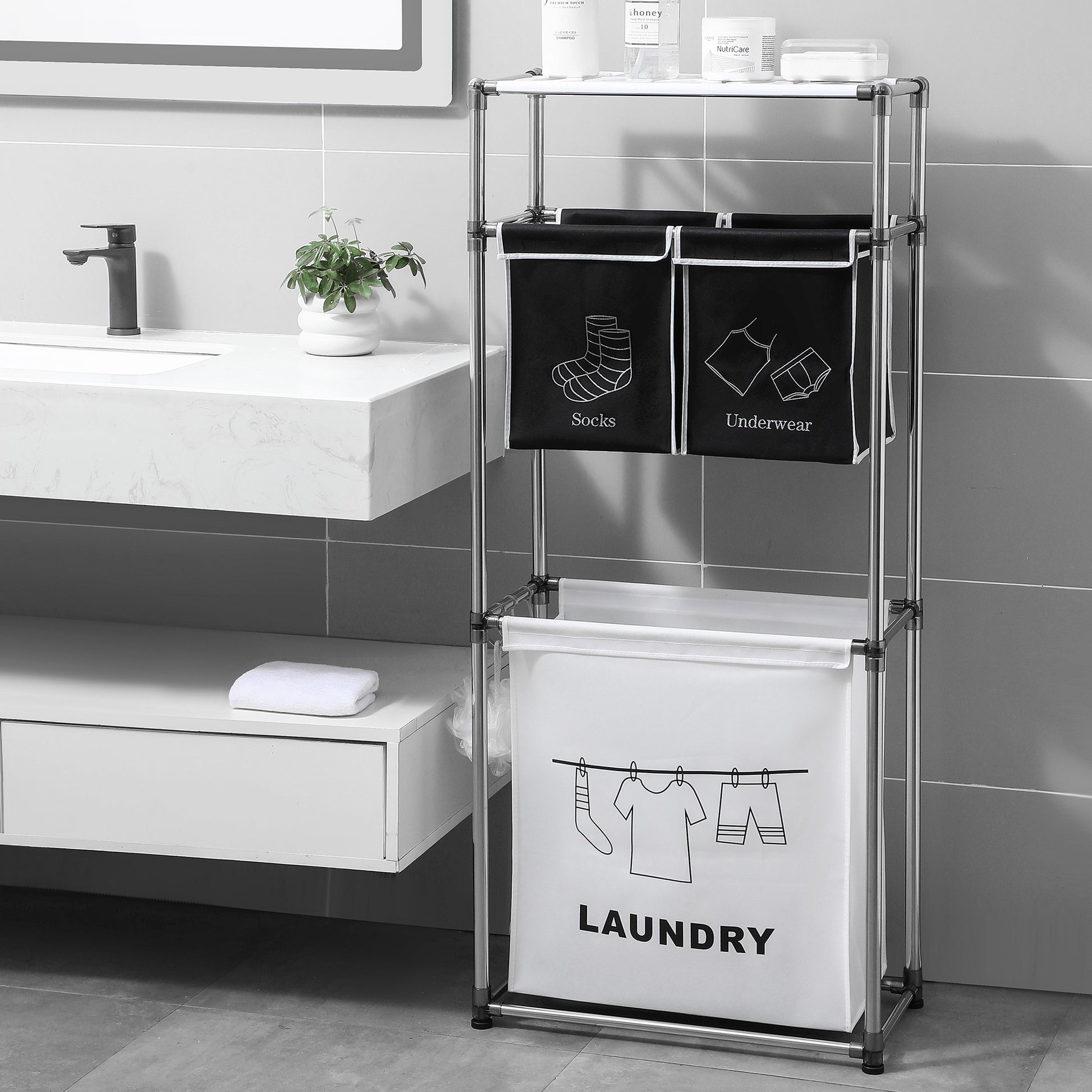 Sleek silver metal laundry hamper with three compartments for organizing clothes
