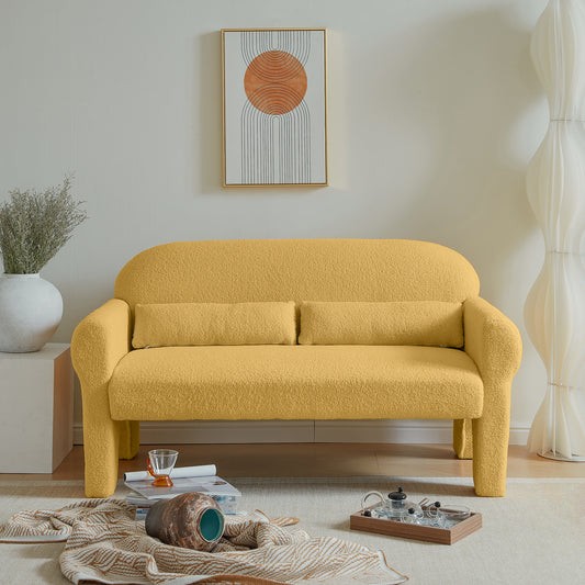 Yellow boucle fabric sofa with rounded arms and two accent pillows