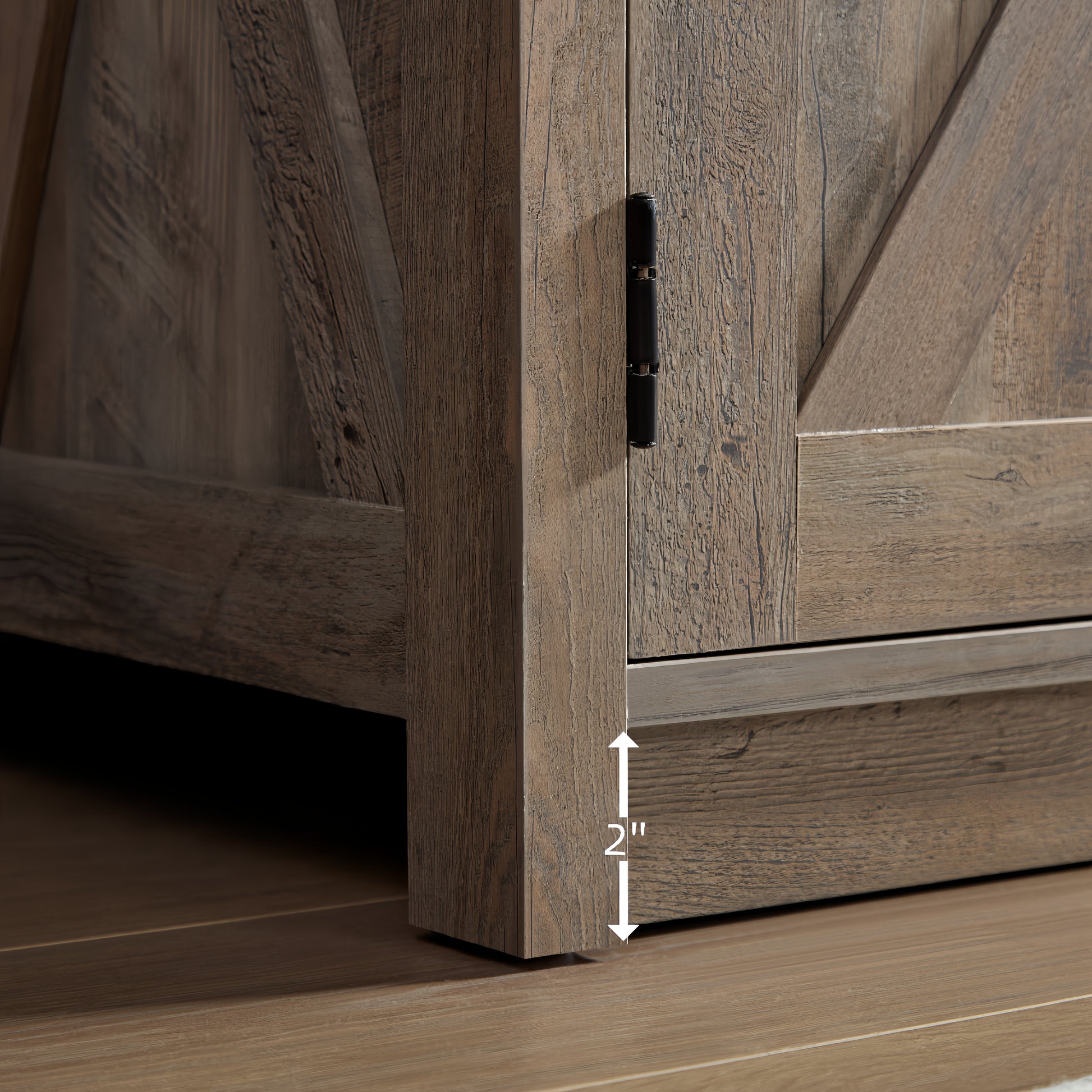 Rustic wood cabinet door detail with black metal hinge and inch leg height indicator