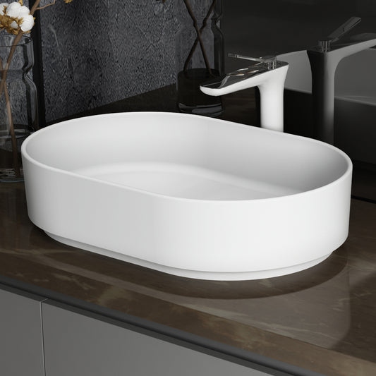 White oval ceramic vessel sink with modern chrome faucet