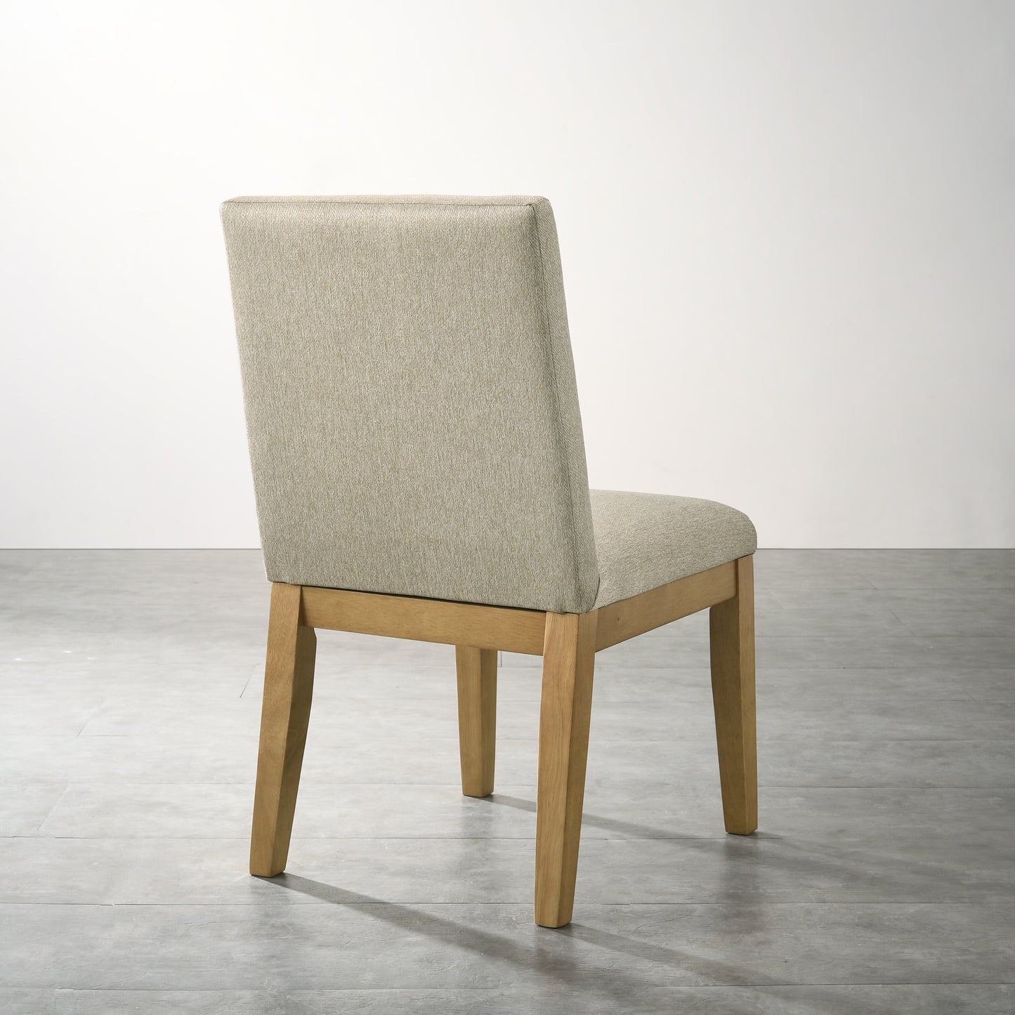 Beige upholstered dining chair with natural wood legs elegant and comfortable