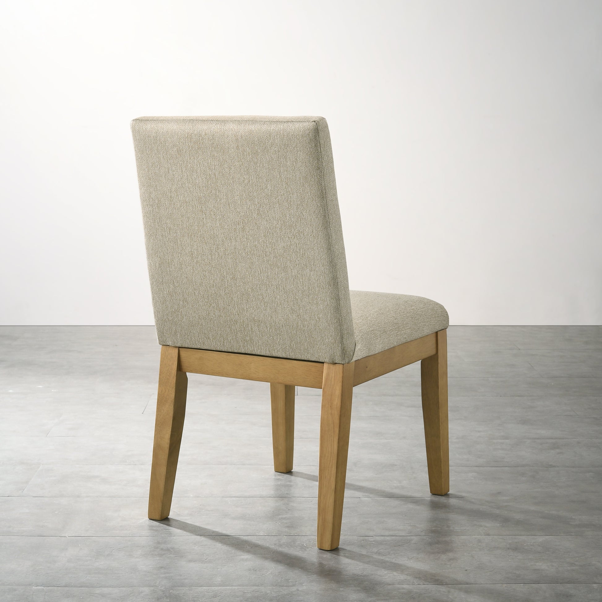 Beige upholstered dining chair with natural wood legs elegant and comfortable