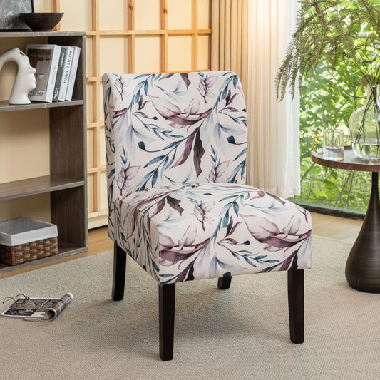 Accent chair with floral upholstery in purple and blue tones on a cream background
