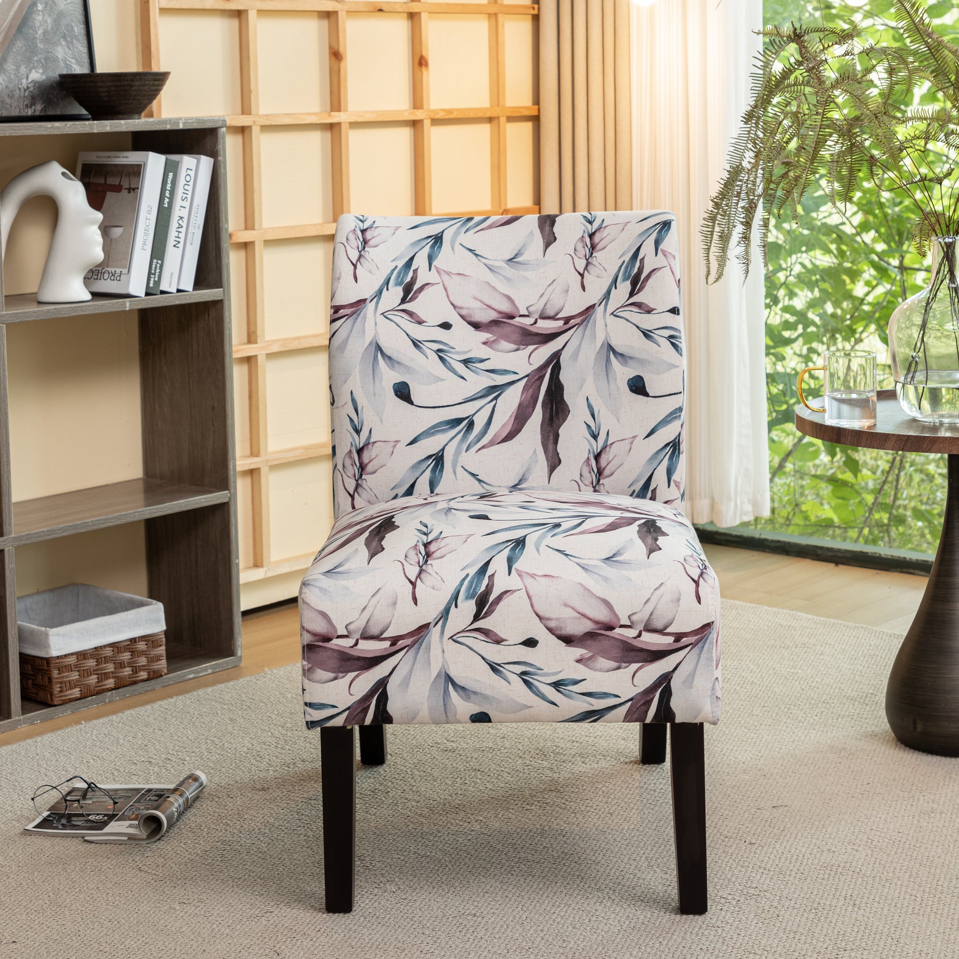Elegant accent chair with a botanical print fabric in blues and purples