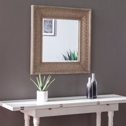Ornate carved wooden frame mirror with traditional detailing x inches