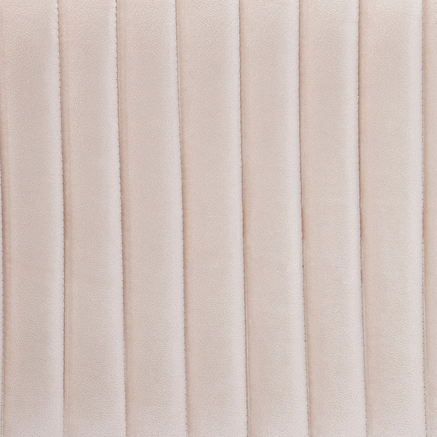 Closeup of beige quilted velvet fabric for upholstery showing vertical stitch details
