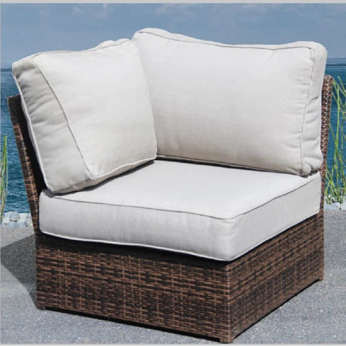 Wicker outdoor sectional chair with beige cushions perfect for patio seating