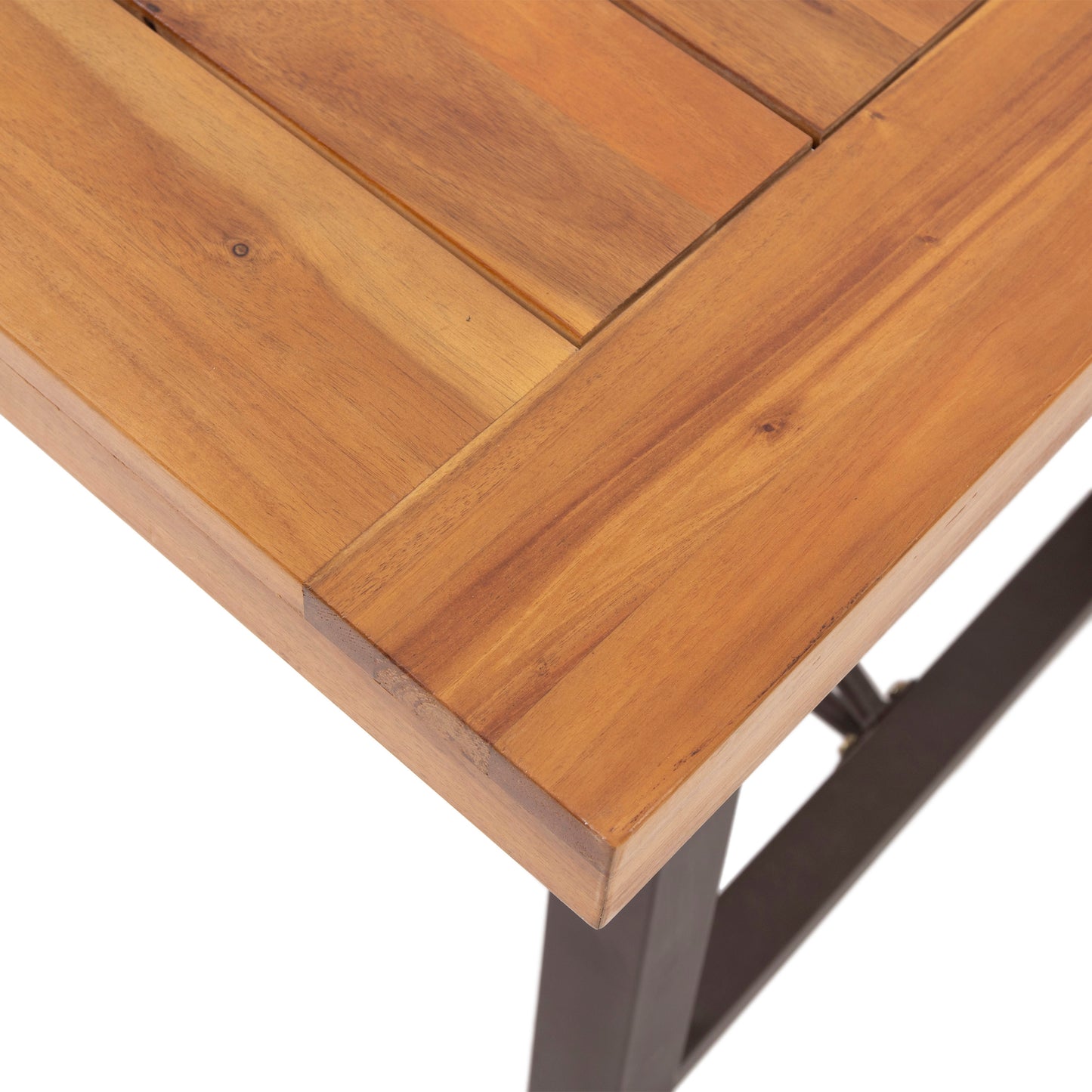 Closeup of a warmtoned wooden slatted dining table top with a matte finish
