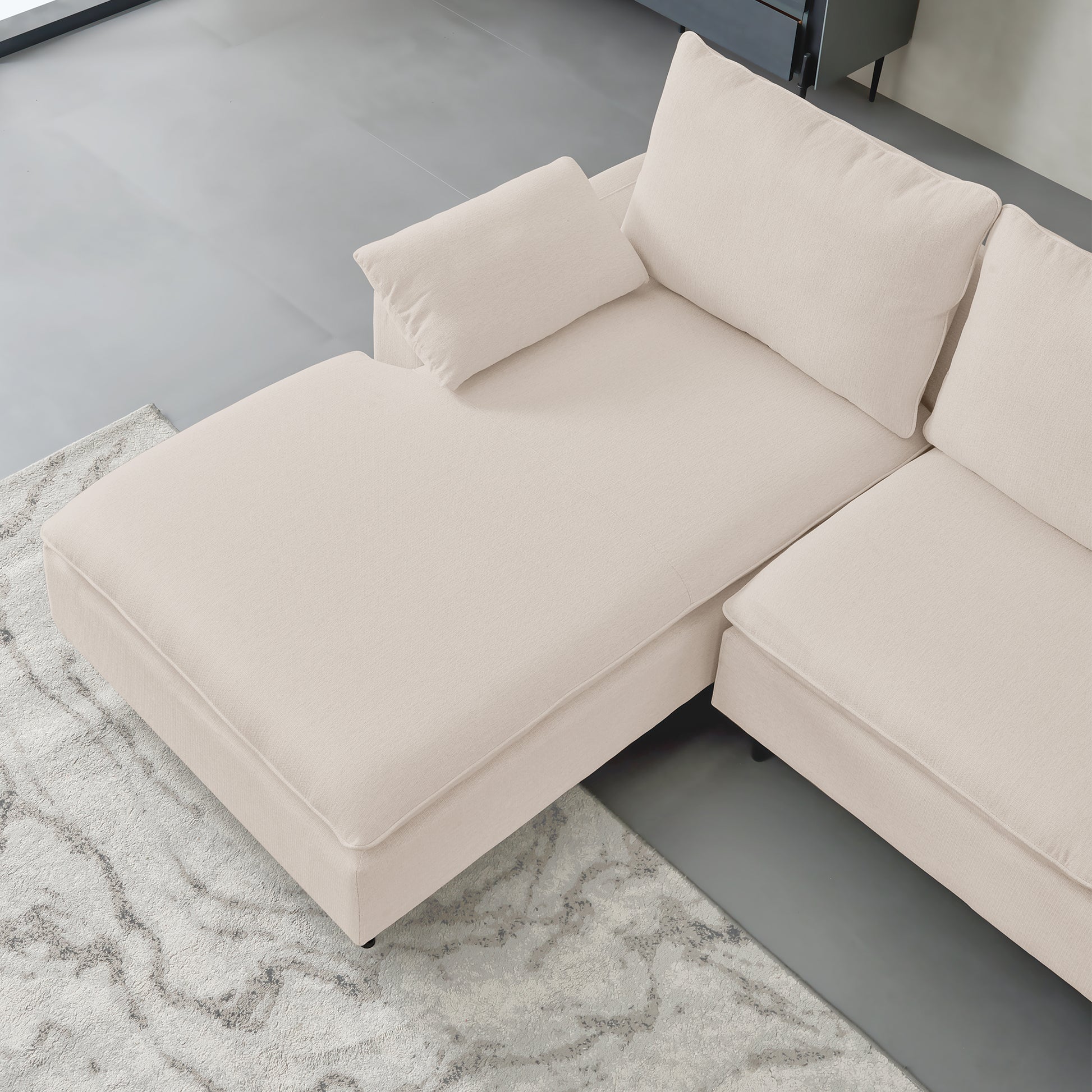 Plush beige sectional sofa with chaise lounge perfect for modern living rooms