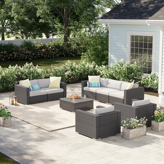 Dark gray wicker outdoor sectional sofa set with light gray cushions for patio relaxation