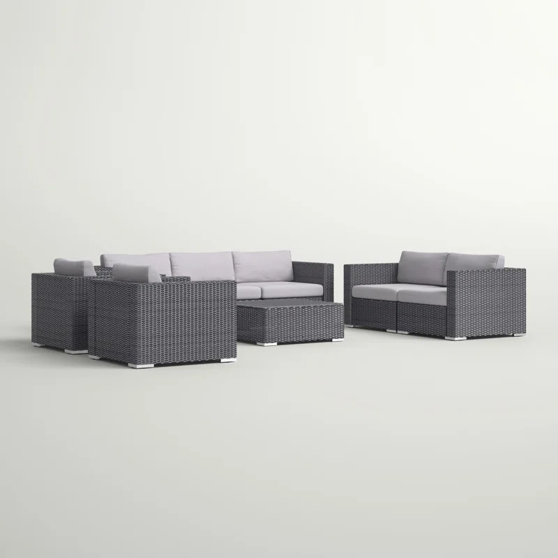Dark gray wicker outdoor sectional with light gray cushions and coffee table