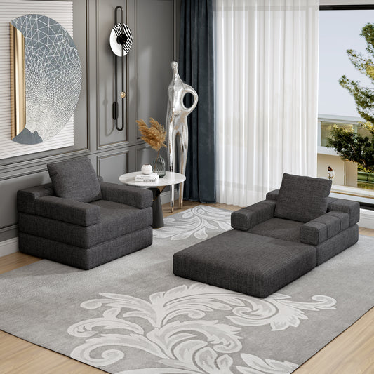Charcoal gray modular sofa with chaise lounge on a damask patterned rug