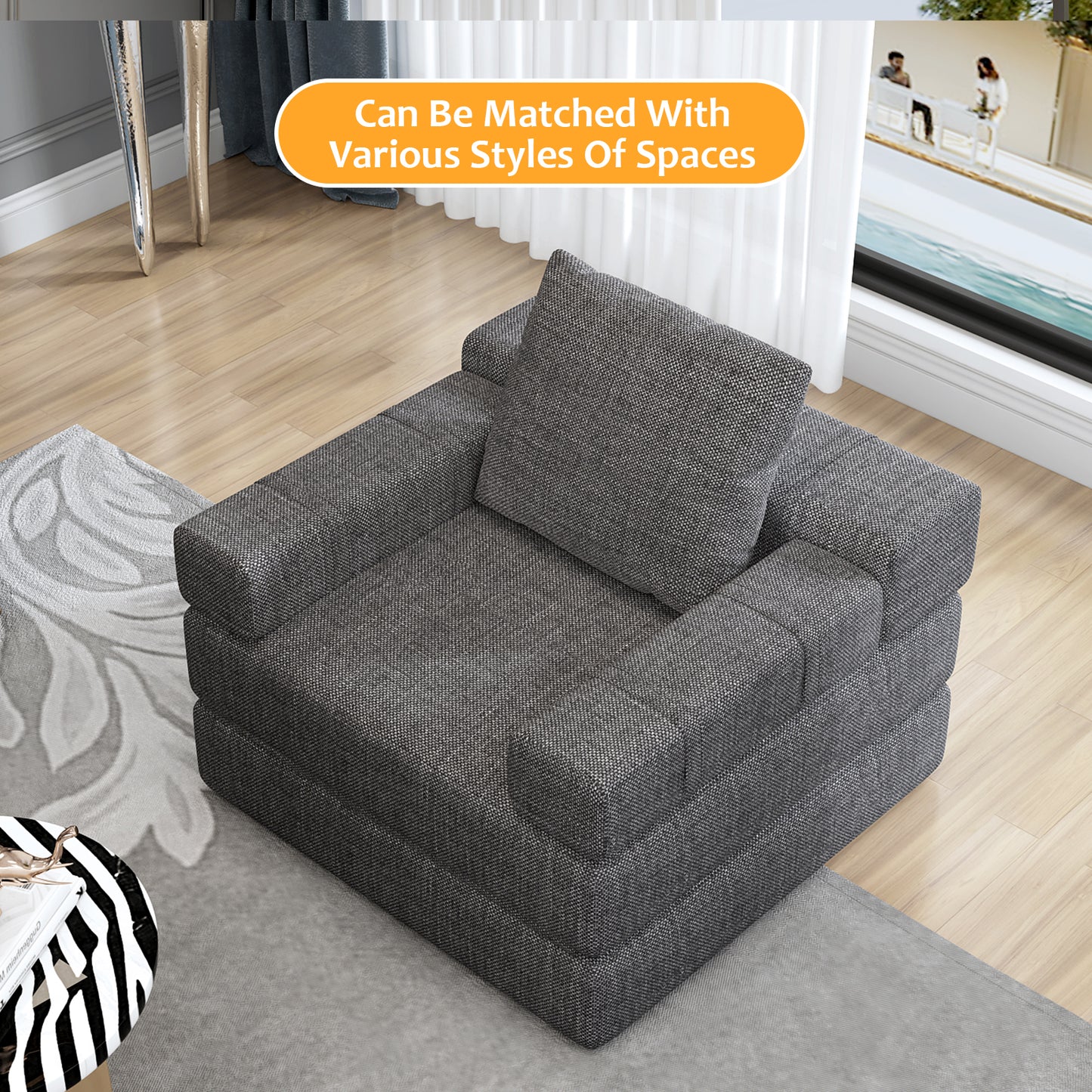 Dark gray fabric modular sofa with square arms and plush cushion on a light wood floor