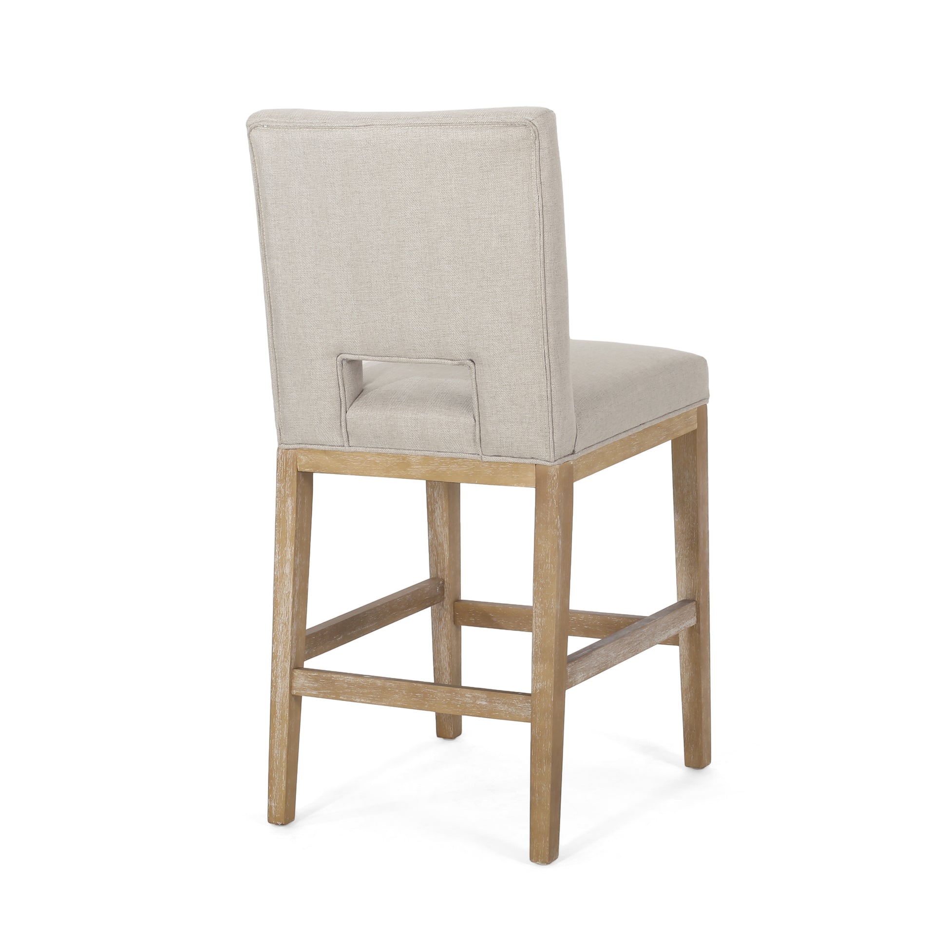 Back view of a neutral beige linen counter stool with a distressed wood frame