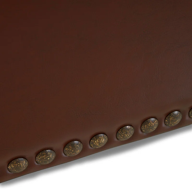 Rich brown faux leather upholstery with decorative nailhead trim detail