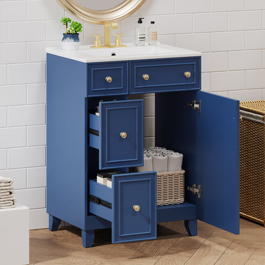 Deep blue bathroom vanity with white countertop and gold hardware featuring open drawers and cabinet