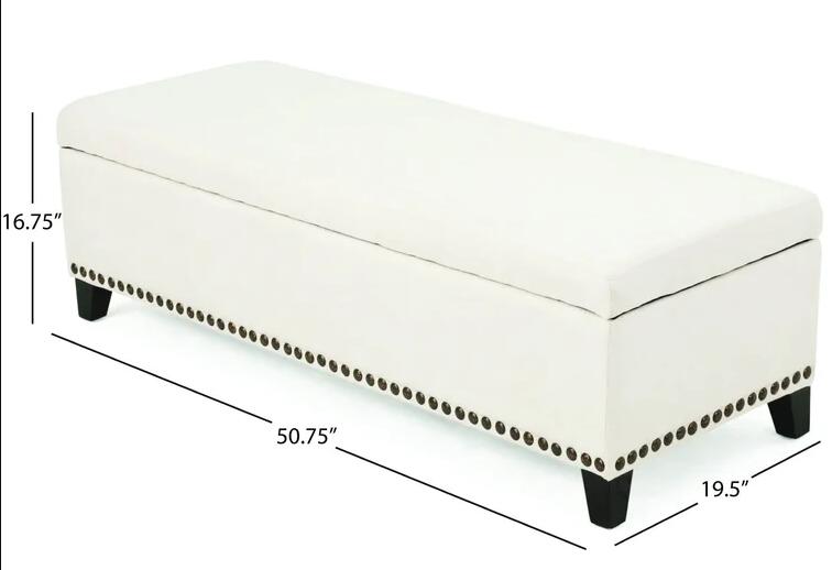 White upholstered storage ottoman with decorative nailhead trim and dark wood legs