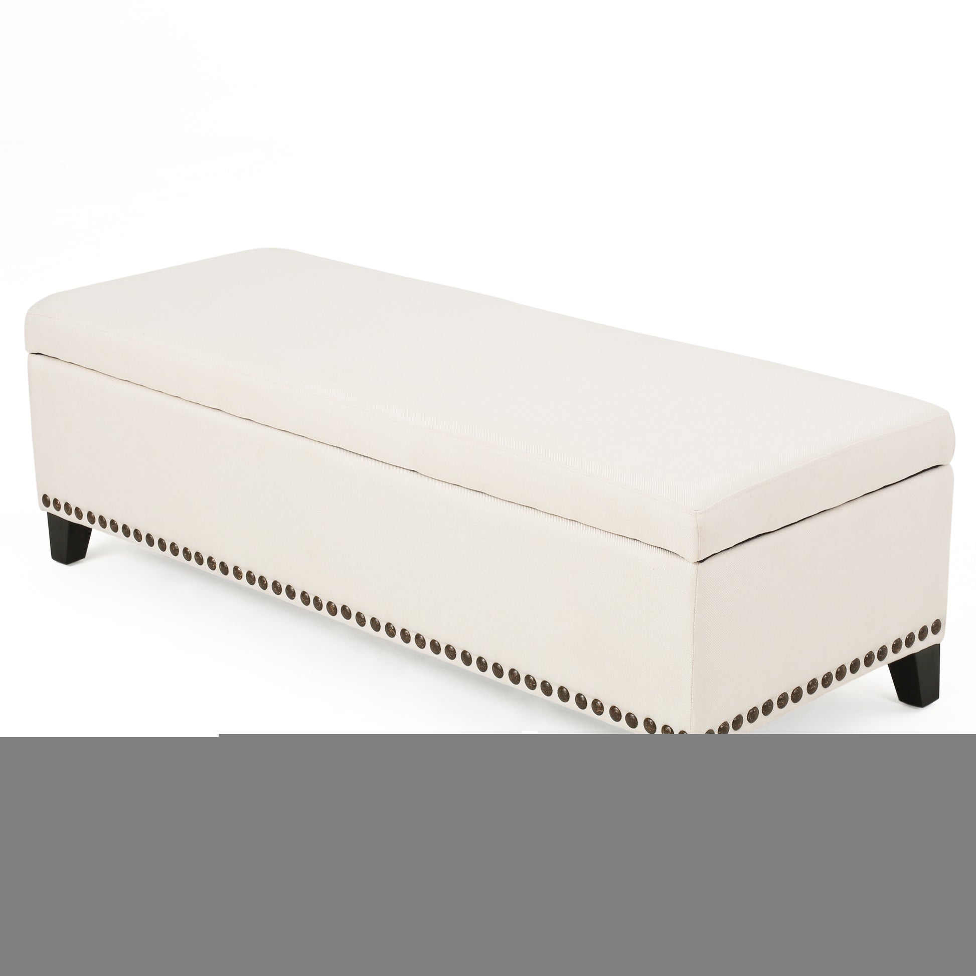 Cream linen storage bench with decorative nailhead trim and dark wooden legs